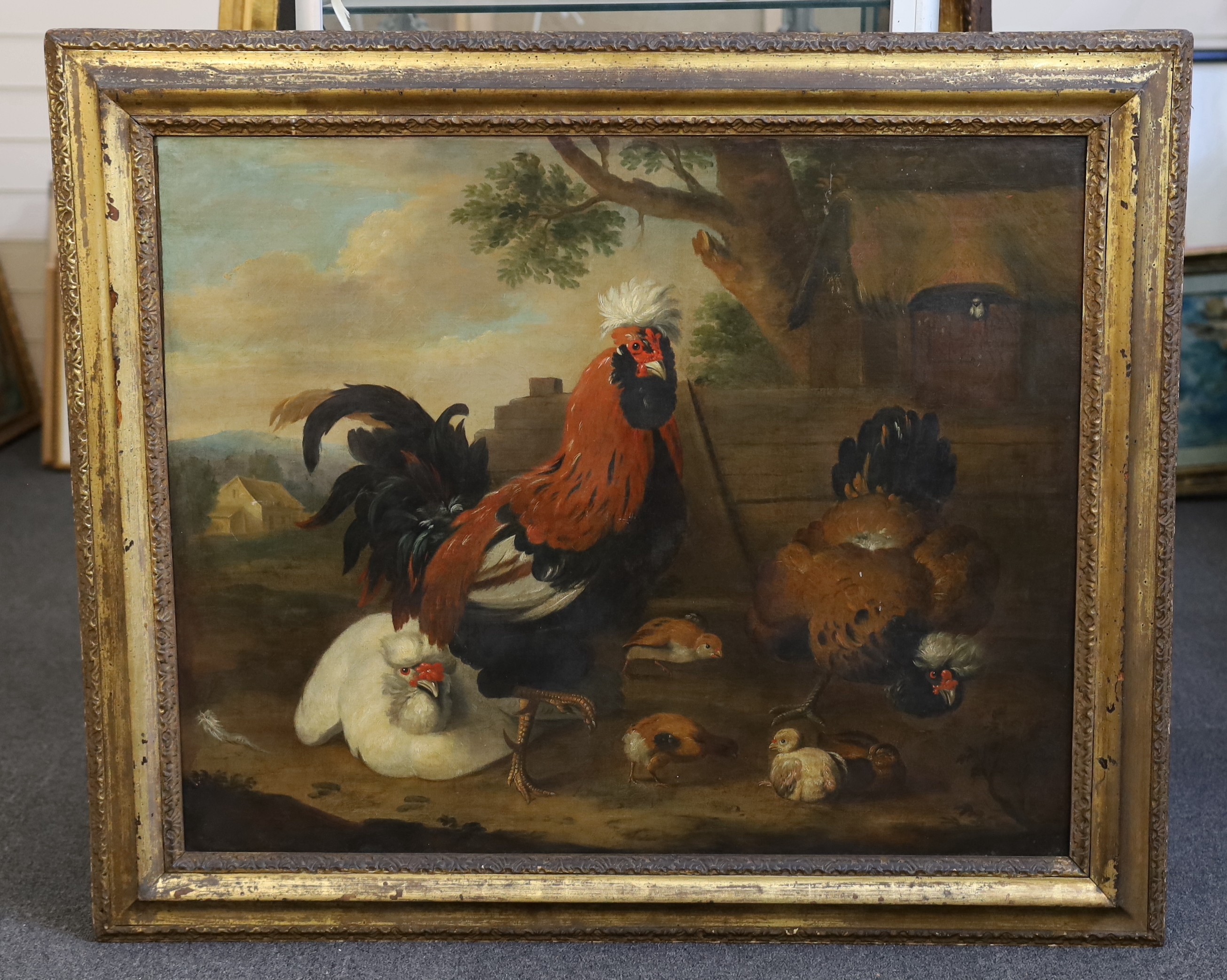 Manner of Melchior d'Hondecoeter (Dutch, c.1636-1695), A cockerel, chickens and chicks in a farmyard, oil on canvas, 70 x 86cm